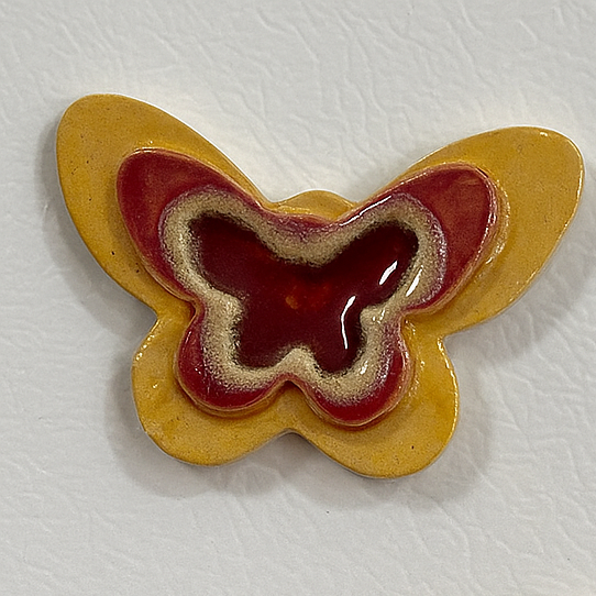 Hand made ceramic Butterfly shaped magnet with glass insert. 